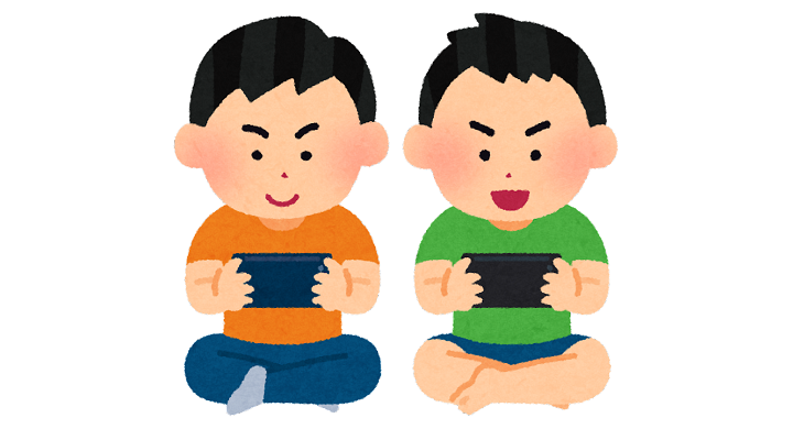 スマートフォンでゲームをやる子供